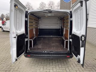 Renault Trafic 1.6 dCi T29 L2H1 Comfort / vaste prijs rijklaar € 16.950 ex btw / lease vanaf € 311 / airco / cruise / navi / pdc achter / bijrijdersbank / lat om lat betimmering !