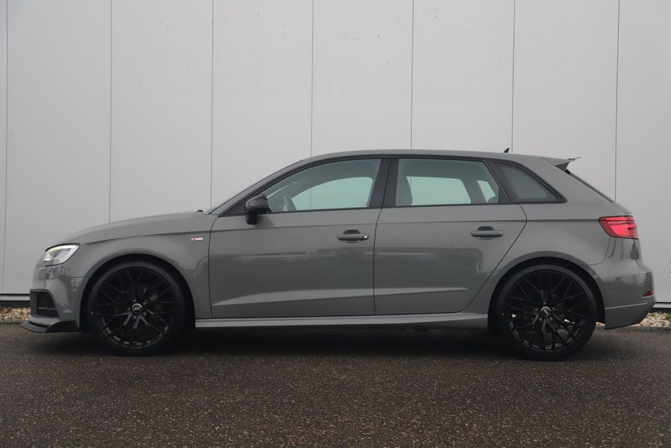 Audi A3 Sportback 30 TFSI Sport S Line Edition Automaat Black Optic Quantumgrey 19 inch Virtual Cockpit Half Leder Navigatie Carplay Android Bluetooth Stoelverwarming Parkeersensors Spoilers